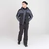 A man wearing a ski jacket and pants stands against a white background. Produktbild-Vorschau
