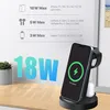 A wireless charging stand with a phone, watch, and earbuds charging. Produktbild-Vorschau