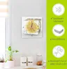 A clock with a lemon slice frozen in an ice cube is displayed on a wall, with product feature callouts on the right. Produktbild-Vorschau