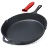 A cast iron skillet with a red silicone handle cover is shown against a white background. Produktbild-Vorschau
