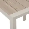 A close-up view of the corner of a table, showing the wooden slats and the frame. Produktbild-Vorschau