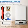 A collection of robotic vacuum cleaner accessories displayed alongside the vacuum itself. Voir les images du produit
