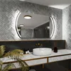 A modern bathroom vanity with a sink, faucet, and a large illuminated mirror. Produktbild-Vorschau