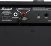 The back panel of a Marshall guitar amplifier, showing various input and output jacks, warning labels, and branding. Náhľad obrázku produktu