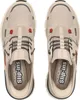 A top-down view of a pair of beige Skechers slip-in sneakers. Voir les images du produit