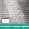A shower head spraying fine water droplets against a textured wall. Produktbild-Vorschau