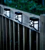 Solar-powered lights mounted on a wooden deck railing at dusk. Anteprima dell’immagine prodotto