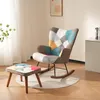 A patchwork rocking chair and ottoman set on a rug in a room. Podgląd zdjęcia produktu