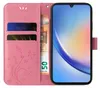 A pink flip phone case with floral and butterfly embossing, showing two credit cards and a 50 Euro banknote inside. A smartphone is displayed within the case. Produktbild-Vorschau