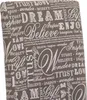 A close-up view of a fabric with a repeating pattern of inspirational words and phrases. Produktbild-Vorschau