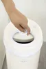 A hand is shown opening the lid of a diaper pail. Náhľad obrázku produktu