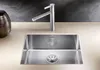 A modern stainless steel kitchen sink with a chrome faucet. Podgląd zdjęcia produktu