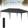 A dark gray canopy tent is set up outdoors, with palm trees and a string of colorful triangular flags in the background.