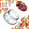 A glass jar is shown tilted on its side, surrounded by various fruits and vegetables, with a logo in the top left corner. Produktbild-Vorschau