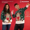 A man and a woman are posing in front of a red background, both wearing Christmas sweaters with a reindeer design. Produktbild-Vorschau