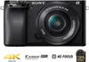 A studio product shot of a black Sony Alpha camera with its lens attached, set against a white background. Promotional text and logos are visible below the camera. Produktbild-Vorschau