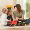 A woman and two children are playing with toy farm vehicles indoors. Produktbild-Vorschau