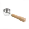 A portafilter with a wooden handle against a white background. Podgląd zdjęcia produktu
