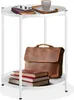 A white two-tiered side table with items on it. Náhled obrázku produktu