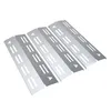 Four stainless steel grill heat shields arranged diagonally on a white background. Produktbild-Vorschau