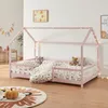 A child's bed with a house frame, decorated with fairy lights, in a bedroom setting. Náhľad obrázku produktu