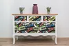 A dresser with drawers decorated with a cassette tape pattern, placed against a white wall. Náhled obrázku produktu