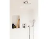 A modern shower fixture with a rainfall showerhead, handheld showerhead, and a built-in niche for toiletries. Produktbild-Vorschau