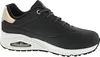 A side view of a black Skechers women's sneaker with a white sole and gold accents. Náhled obrázku produktu
