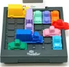 A close-up shot of a traffic-themed logic puzzle game with colorful toy cars and trucks arranged on a dark gray game board. Podgląd zdjęcia produktu