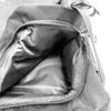 A close-up view of the interior of an open backpack pocket. Produktbild-Vorschau