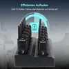 A charging station with multiple walkie-talkies plugged in. Produktbild-Vorschau