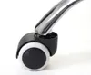 A close-up of a black and white office chair caster wheel with a chrome support arm. Anteprima dell’immagine prodotto