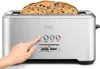 A hand is pressing a button on a Sage toaster with bread inside. Produktbild-Vorschau