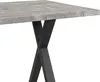 A close-up view of a table with a concrete-look top and an X-shaped black metal base. Produktbild-Vorschau