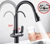 A black kitchen faucet with a pull-down sprayer is shown filling a glass of water. The faucet has a secondary spout for filtered water. The image also shows a diagram of the faucet's components in the upper right corner. Náhľad obrázku produktu
