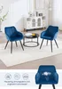 Two blue velvet chairs and a coffee table in a living room setting. Náhľad obrázku produktu