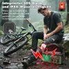 A man is sitting on a rock next to a bicycle in the rain, with a radio device in the foreground. Produktbild-Vorschau