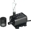 A black submersible water pump with water spraying from its outlet, shown on a white background with a separate filter attachment. Podgląd zdjęcia produktu
