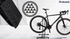A bicycle is shown on a stand with a close-up of a black pedal in the foreground and a logo in the background. Náhľad obrázku produktu