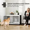 A woman sits on a couch next to a dog crate while a golden retriever stands in front of it. Anteprima dell’immagine prodotto