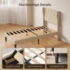 A bed frame with a wingback headboard is shown in a room with wooden flooring and a window with curtains. Three close-up insets highlight specific features. Náhled obrázku produktu