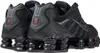 A pair of black Nike Shox TL sneakers shown from a rear-side angle. Produktbild-Vorschau