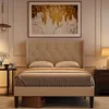 A bedroom scene featuring a beige upholstered bed with a wingback headboard. Produktbild-Vorschau