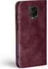 A close-up side view of a burgundy flip phone case. Produktbild-Vorschau