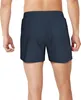 Back view of a man wearing navy blue swim shorts. Podgląd zdjęcia produktu