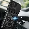 A black phone case with a ring stand and camera cover is attached to a magnetic car mount inside a car. Produktbild-Vorschau