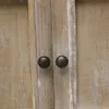 A close-up view of two drawer knobs on a wooden cabinet. Podgląd zdjęcia produktu