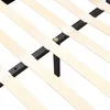 A close-up view of a bed frame's wooden slats and black metal supports. Náhled obrázku produktu