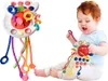 A baby is playing with a colorful sensory toy. Náhľad obrázku produktu