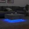 A modern living room with a couch, coffee table with LED lights, and a plant. Voir les images du produit